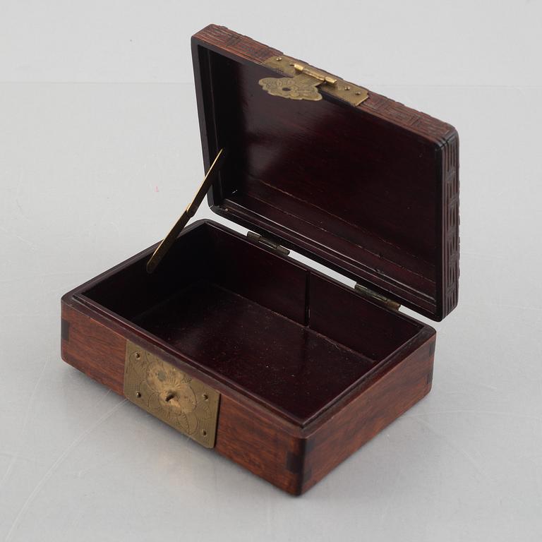 Two Chinese hardwood boxes with nephrite plaques, 20th century.