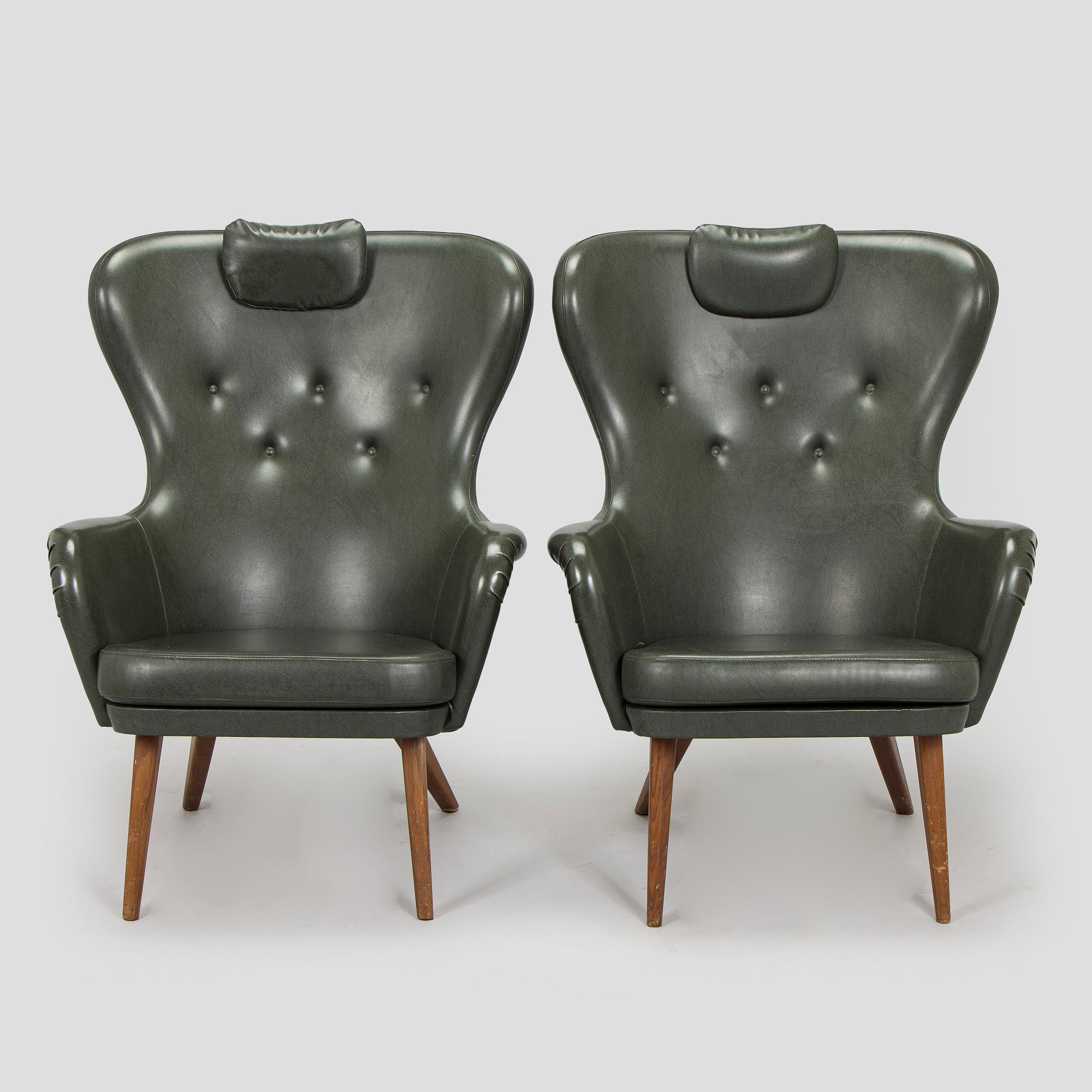 A pair of mid-20th century armchairs.