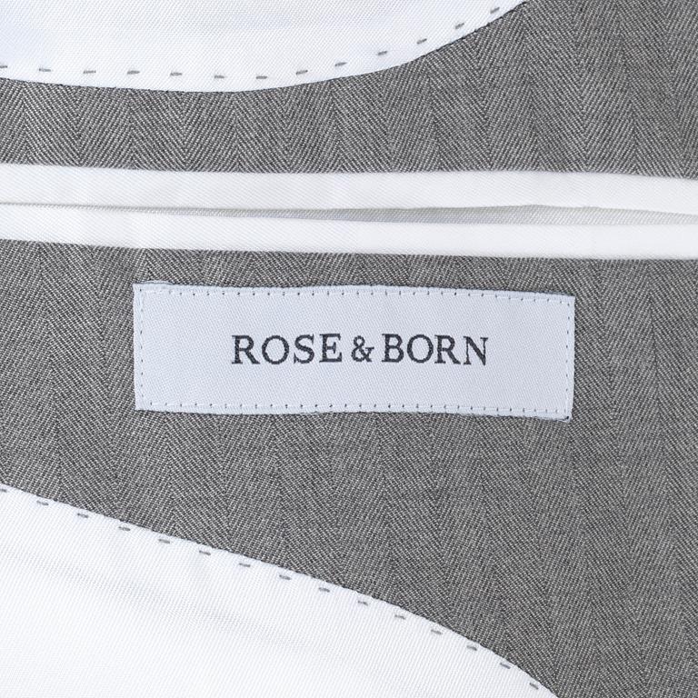 ROSE & BORN, a grey herringbone cotton suit consisting of jacket and pants. Size 54.
