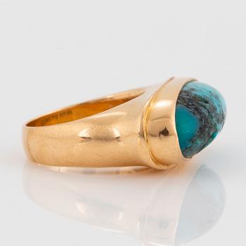 An 18K gold ring set with a turquoise, by Claës Giertta.