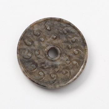 A group of three archaistic Chinese stone bi discs and two pendants.