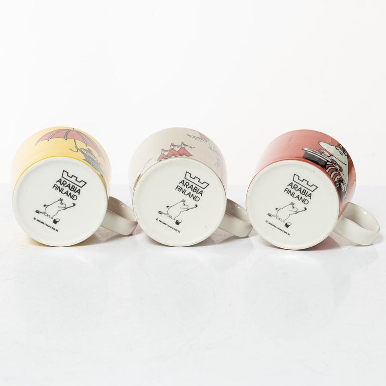 A set of 24 Moomin mugs, Arabia, Finland.