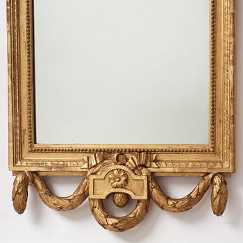 A Gustavian giltwood mirror by C. G. Fyrwald (master in Stockholm 1776-1825).