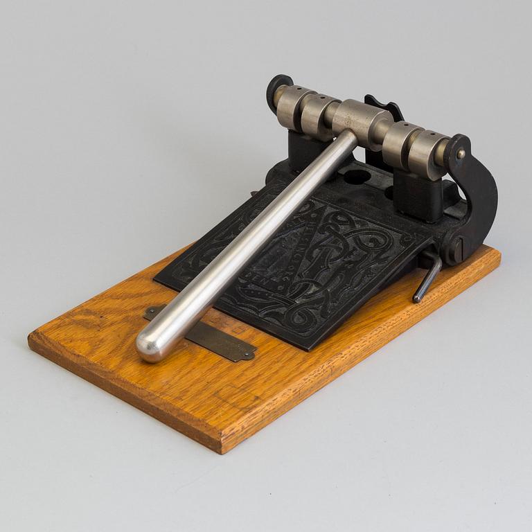 A early 20th century perforator.