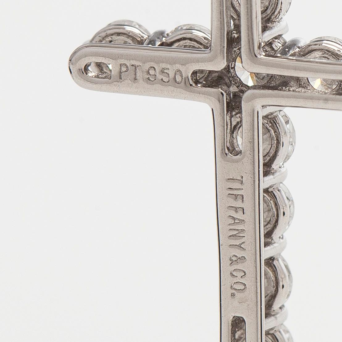 Tiffany & Co, a platinum cross pendant necklace with brilliant-cut diamonds.