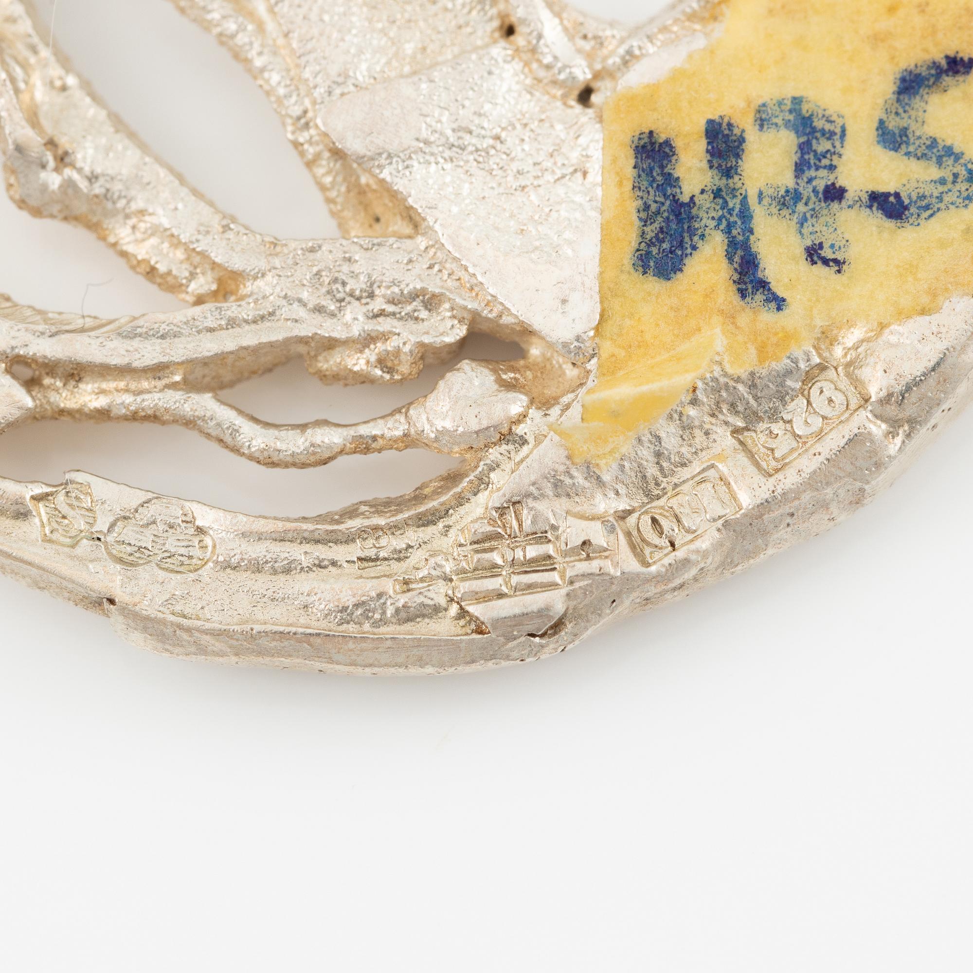 Lars Arby, three neck rings and two pendants, silver with enamel.