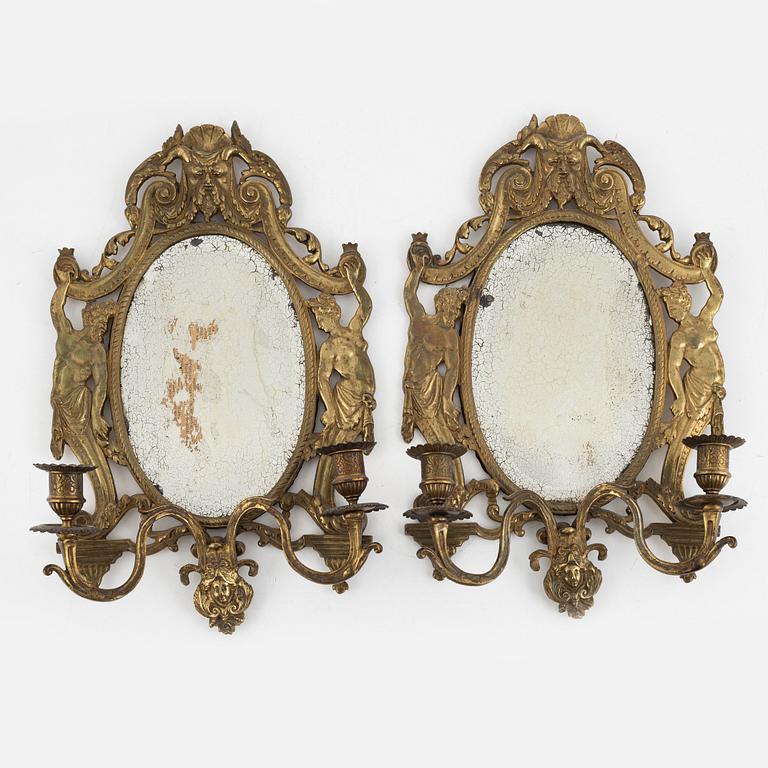 A pair of eclectic mirror sconces, first half of the 20th century.