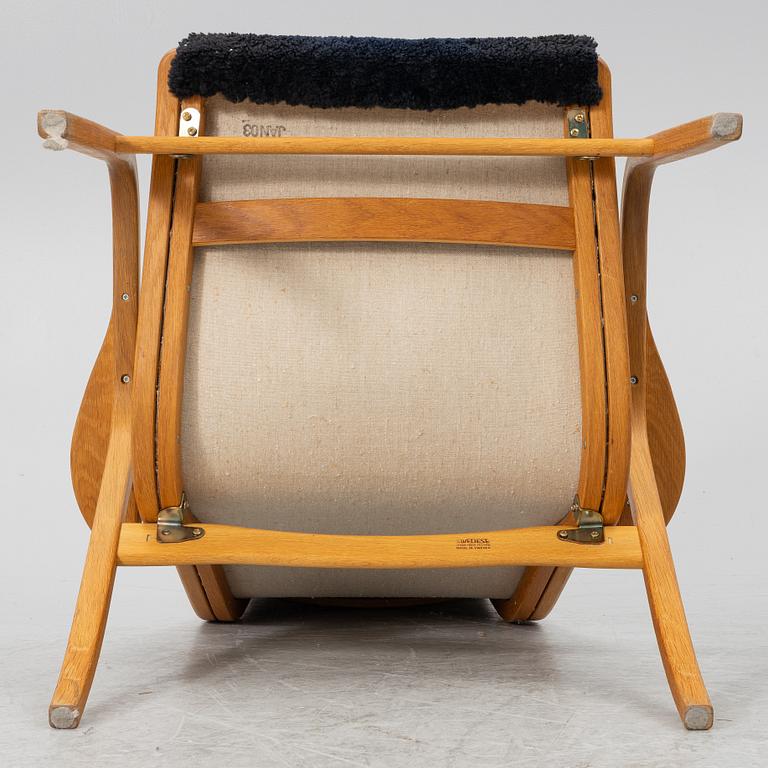 Yngve Ekström, a 'Lamino' armchair with ottoman, Swedese.