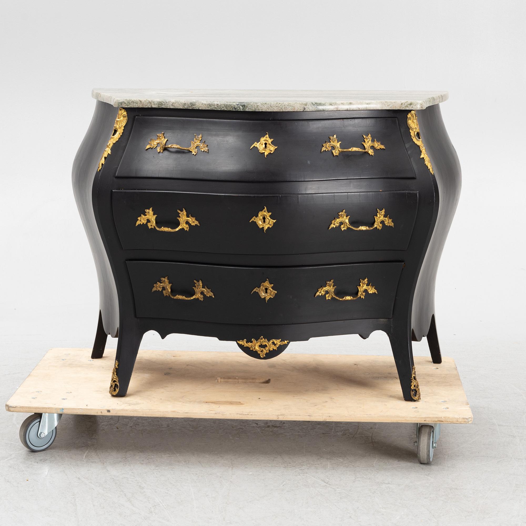 A Rococo style chest of drawers, mid 20th Century.