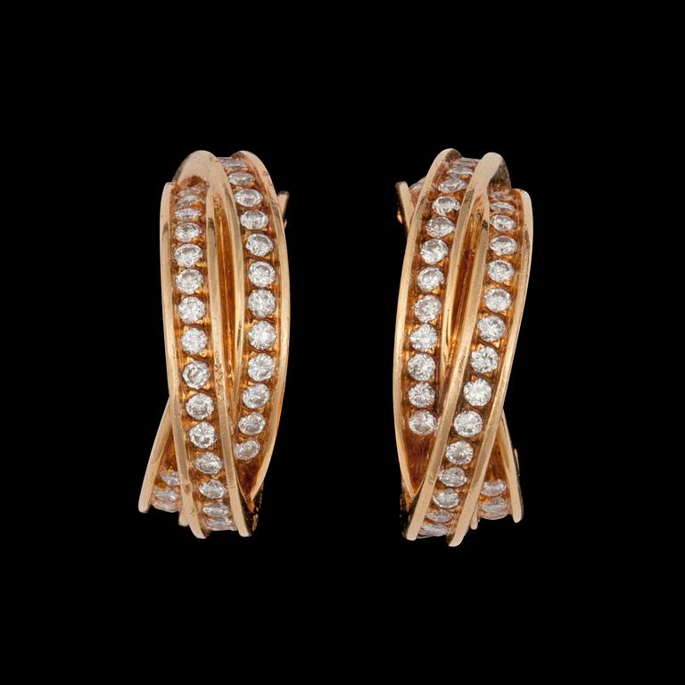 A pair of Cartier diamond earrings. Total carat weight circa 1.25 cts. No. 617280.