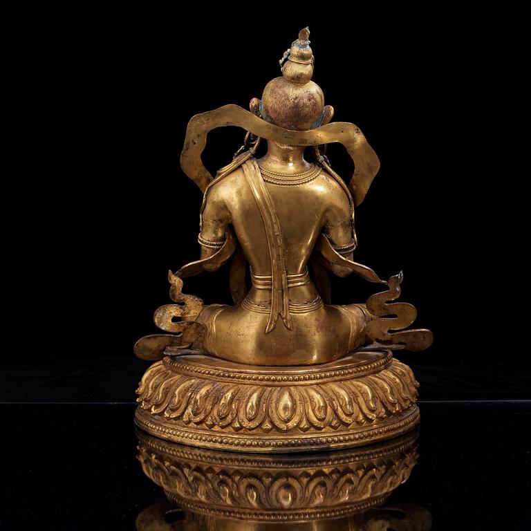 A large gilt bronze figure of Tara, with Qianlong mark.