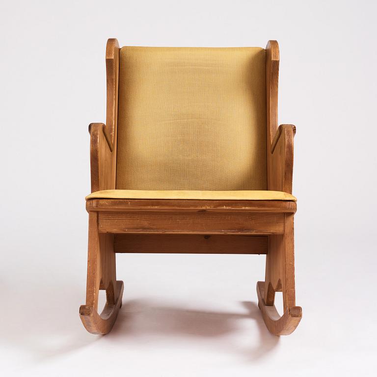 Nordiska Kompaniet, a Swedish Modern stained pine 'Lovö' rocking chair.