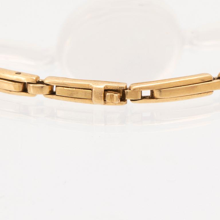 An 18K white and red gold watch set with round old cut diamonds.