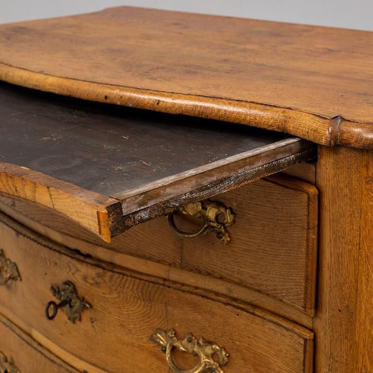 A 18th century rococo chest of drawers.