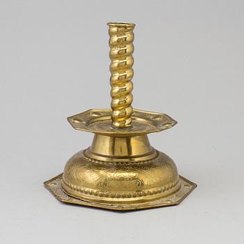 A 18th century Baroque brass candlestick.