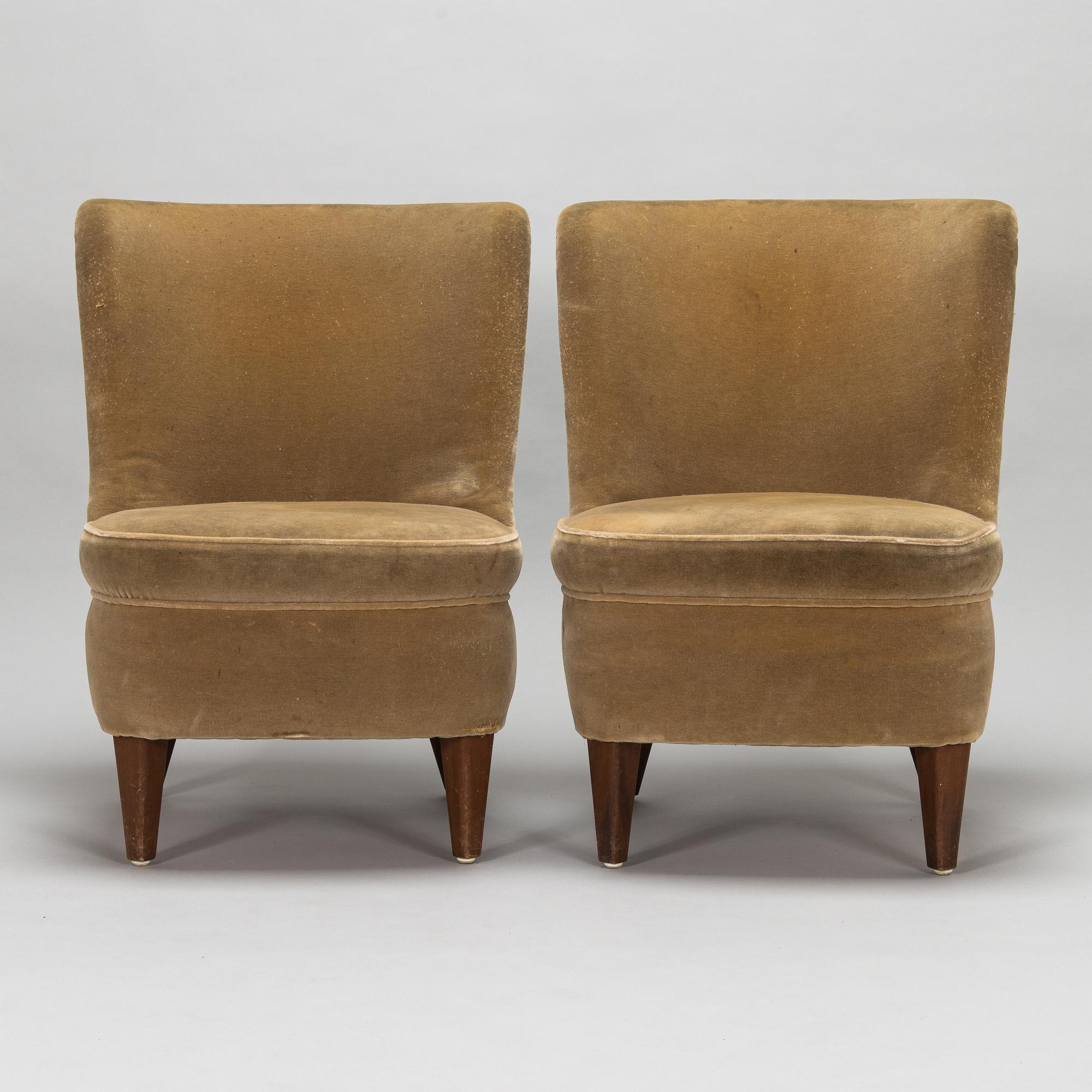 A pair of 1950s armchairs.