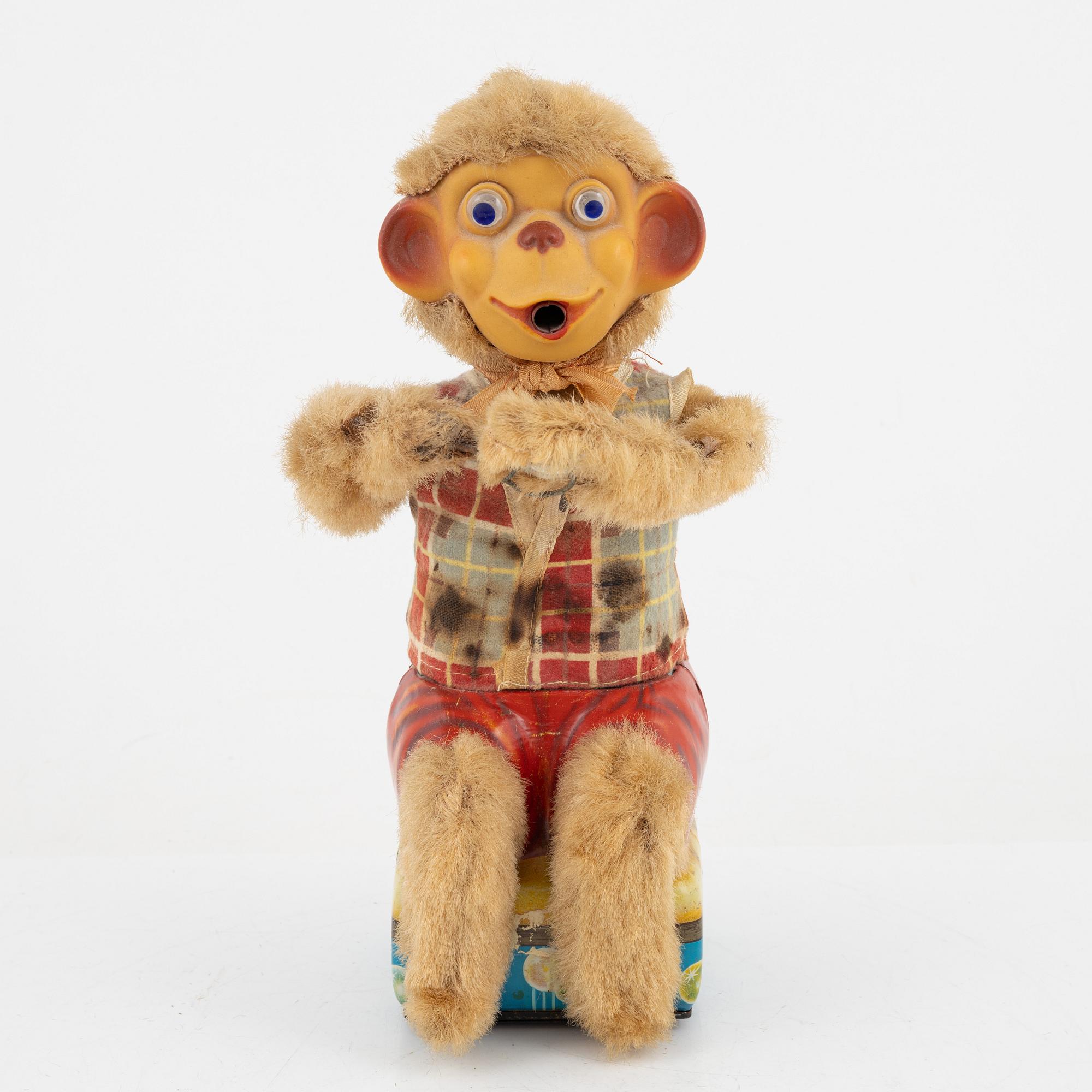 A set of five toys, including 'Rolly' clown from Schuco, 20th century.