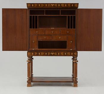 A Gösta Thorell cabinet on stand, Stockholm 1929, executed by Georg Ryman.