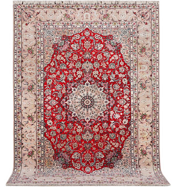 An Esfahan carpet, part silk, signed Rahmi, c. 298 x 206 cm.