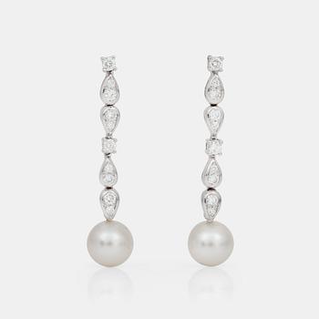 714. A pair of Boucheron diamond, 0.86 cts, and cultured pearl earrings.