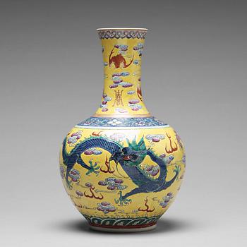 A yellow glazed five clawed dragon vase, probably late Qing dynasty with Guangxus mark.