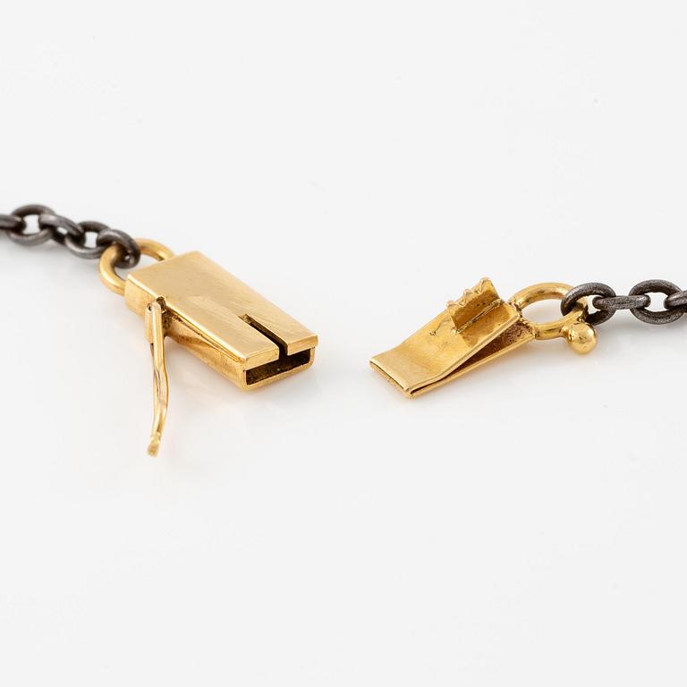 An 18K gold and iron necklace with pearls, late 19th century.