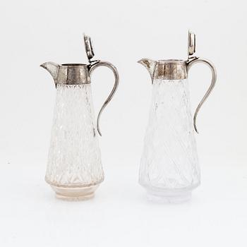 John Grinsell & Sons, a pair of silver and glass carafes, Birmingham 1880.