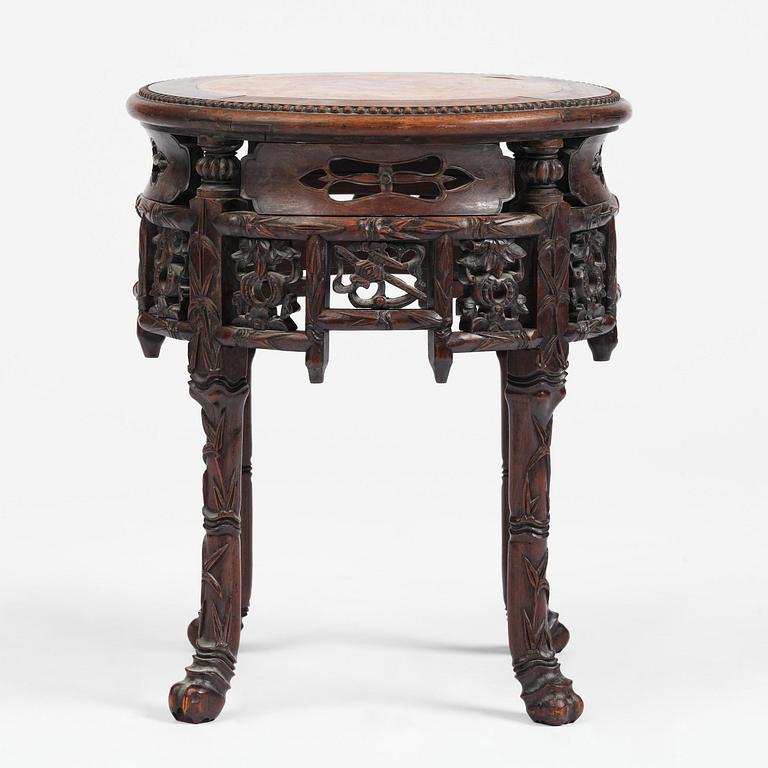 A Chinese hardwood table with a marble top, late Qing dynasty.