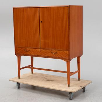 A mahogany veneered cabinet, 1940s/50s.