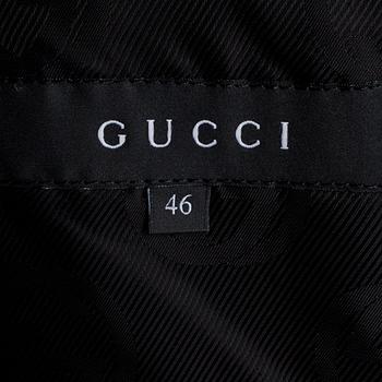 GUCCI, a dark grey wool blend jacket.