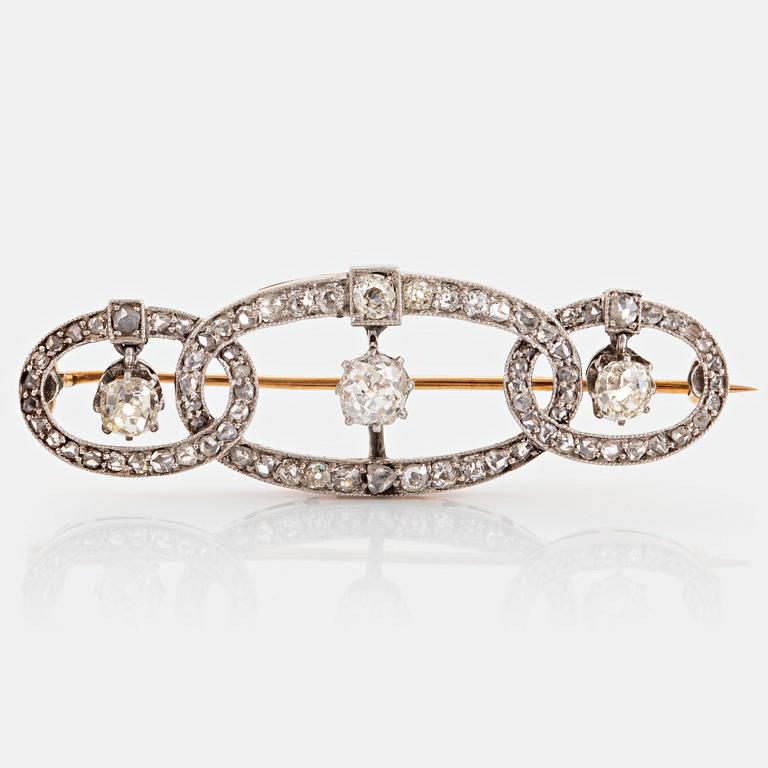 A platinum and gold brooch set with old- and rose-cut diamonds.