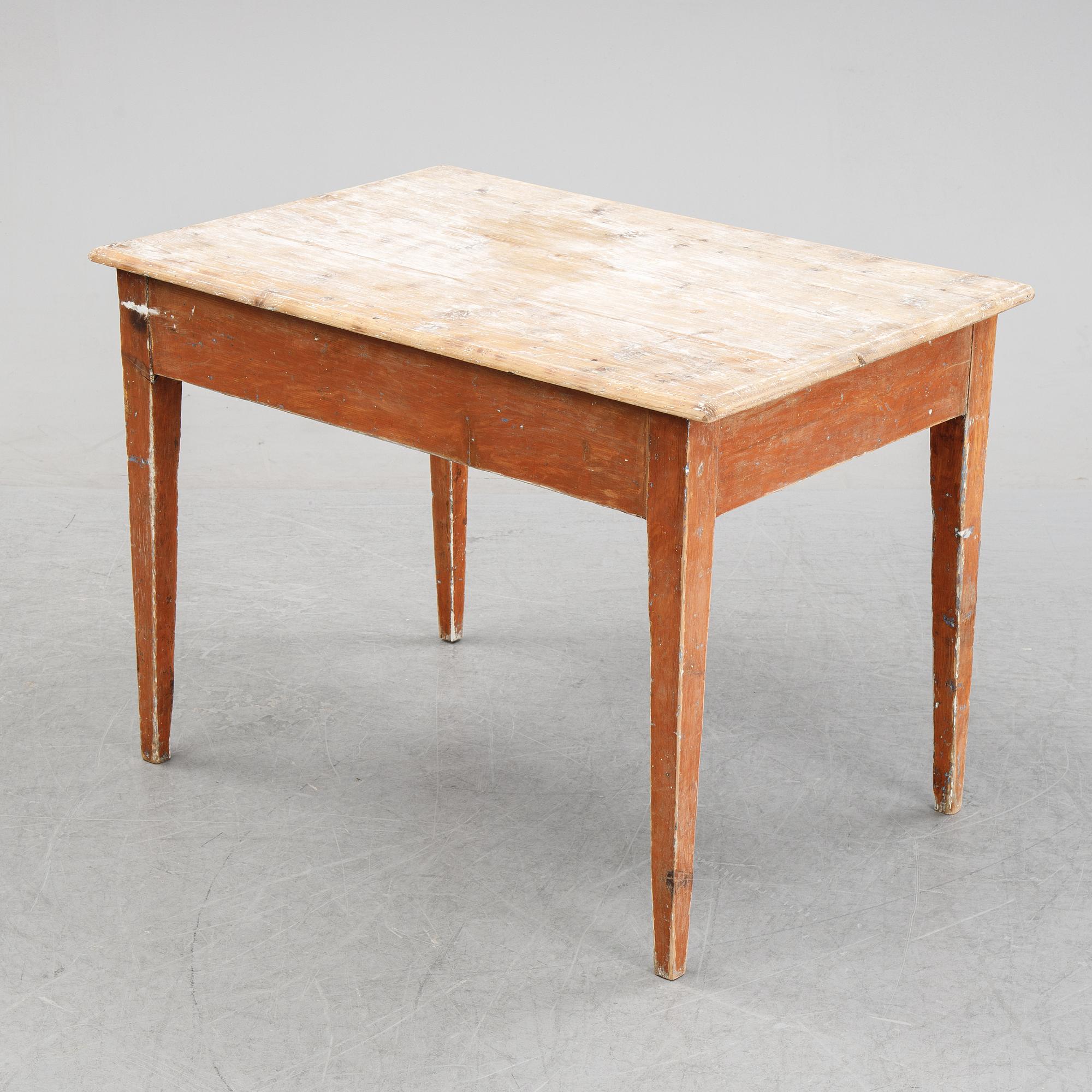 A 19/20th Century table with a drawer.