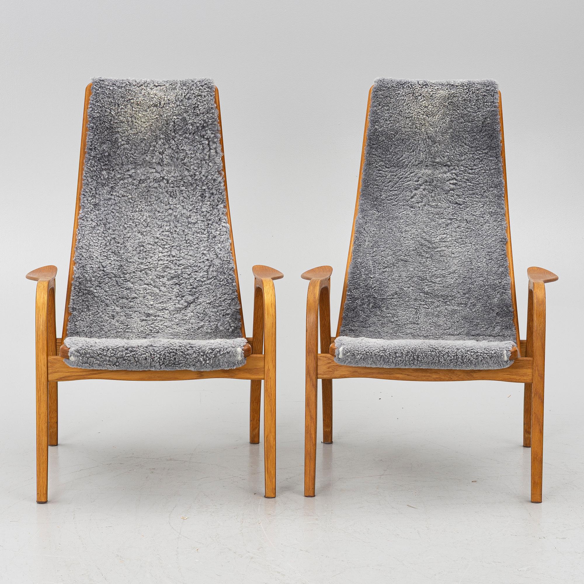 Yngve Ekström, A pair of armchairs, a footstool, “Lamino”, and a side table, Swedese, 2000s.
