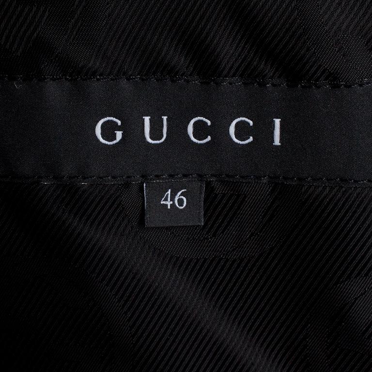 GUCCI, a dark grey wool blend jacket.