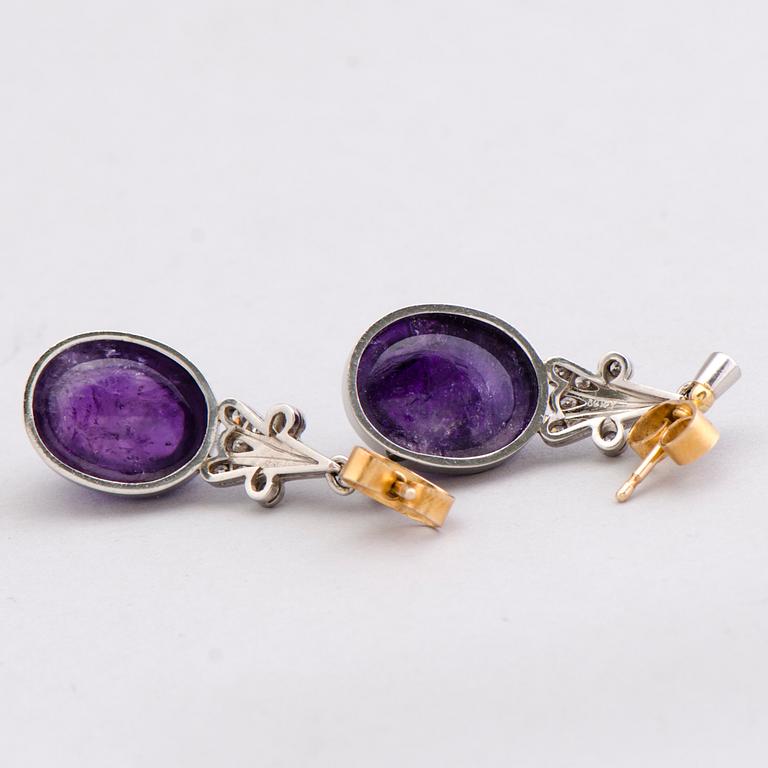 A PAIR OF EARRINGS, cabochon cut amethysts, diamonds, 18k white gold and gold. A. Tillander.