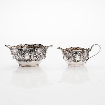 A set of four salt cellars with spoons, and a cream jug and sugar bowl, London, England 1902-1903.