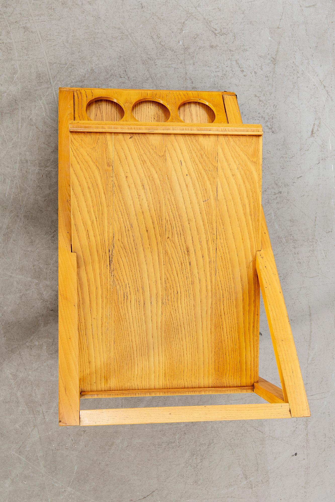 An Italian oak trolley later part of the 20th century.