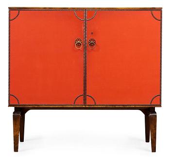 748. An Otto Schulz cabinet on stand with artificial red leather and brass details on a stained oak and birch stand, by Boet, Gothenburg, probably 1950's.