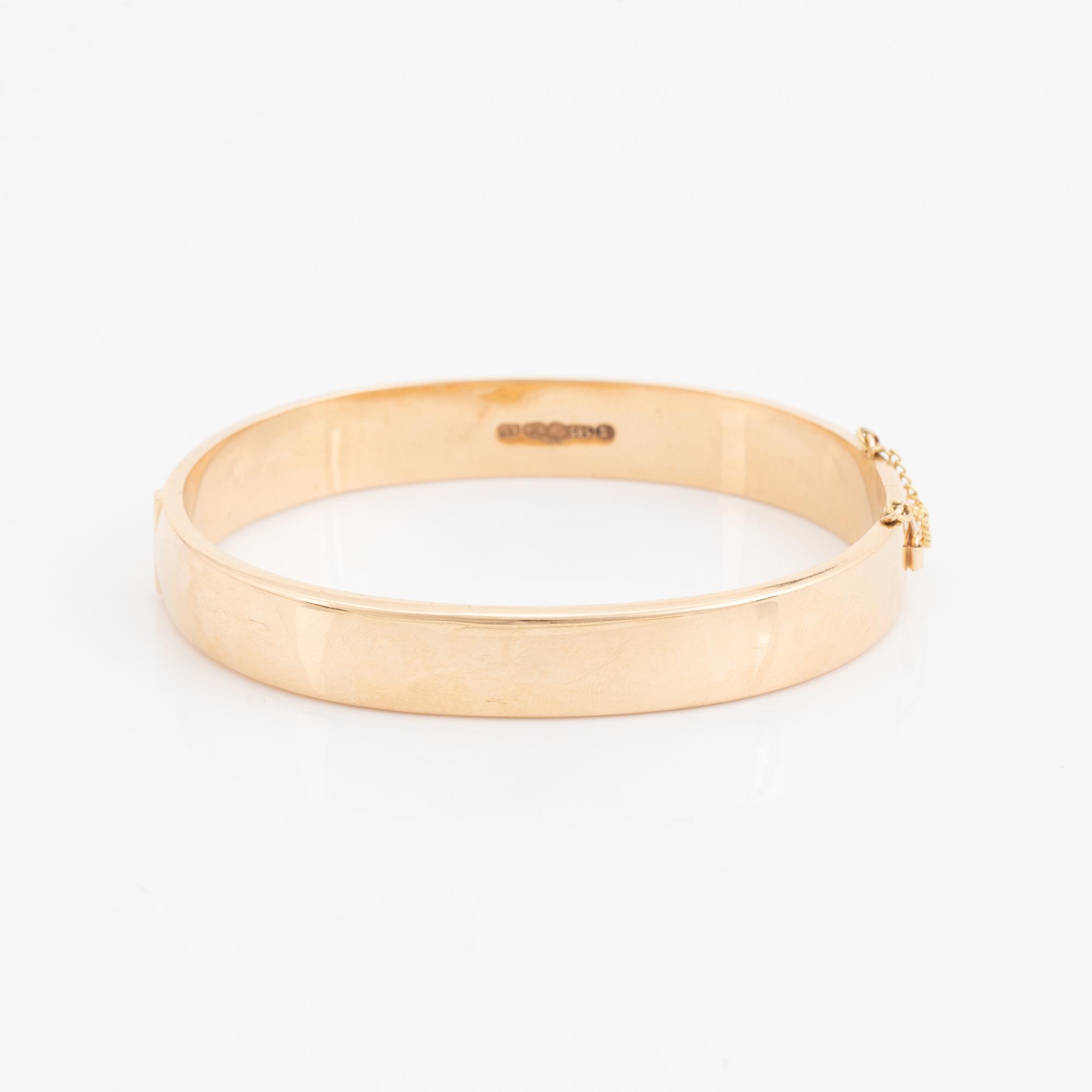 A 14K gold bracelet.