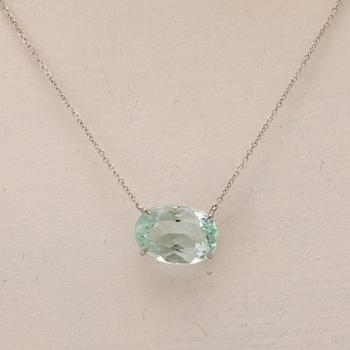An 18K white gold necklace with an oval faceted aquamarine.