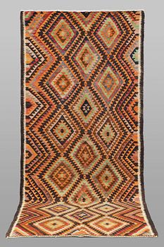 A  Persian nomadic Kilim rug, approx. 300 x 143 cm.