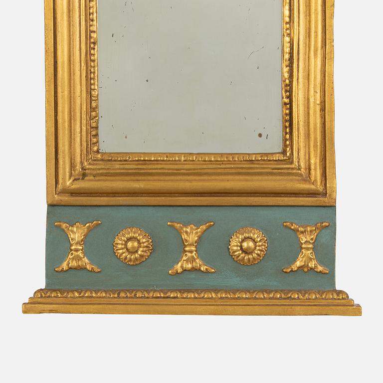 A Swedish giltwood empire mirror, first part of the 19th century.