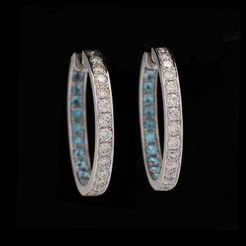 A pair of briliant cut diamond earrings tot. app. 1.70 ct set with facett cut topazs.