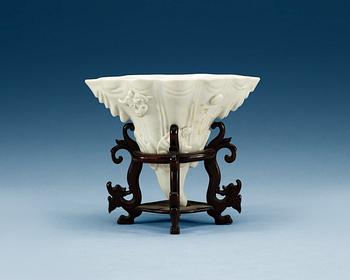 1751. A blanc de chine libation cup in the shape of a rhinoseroushorn, Qing dynasty, Kangxi (1662-1722).