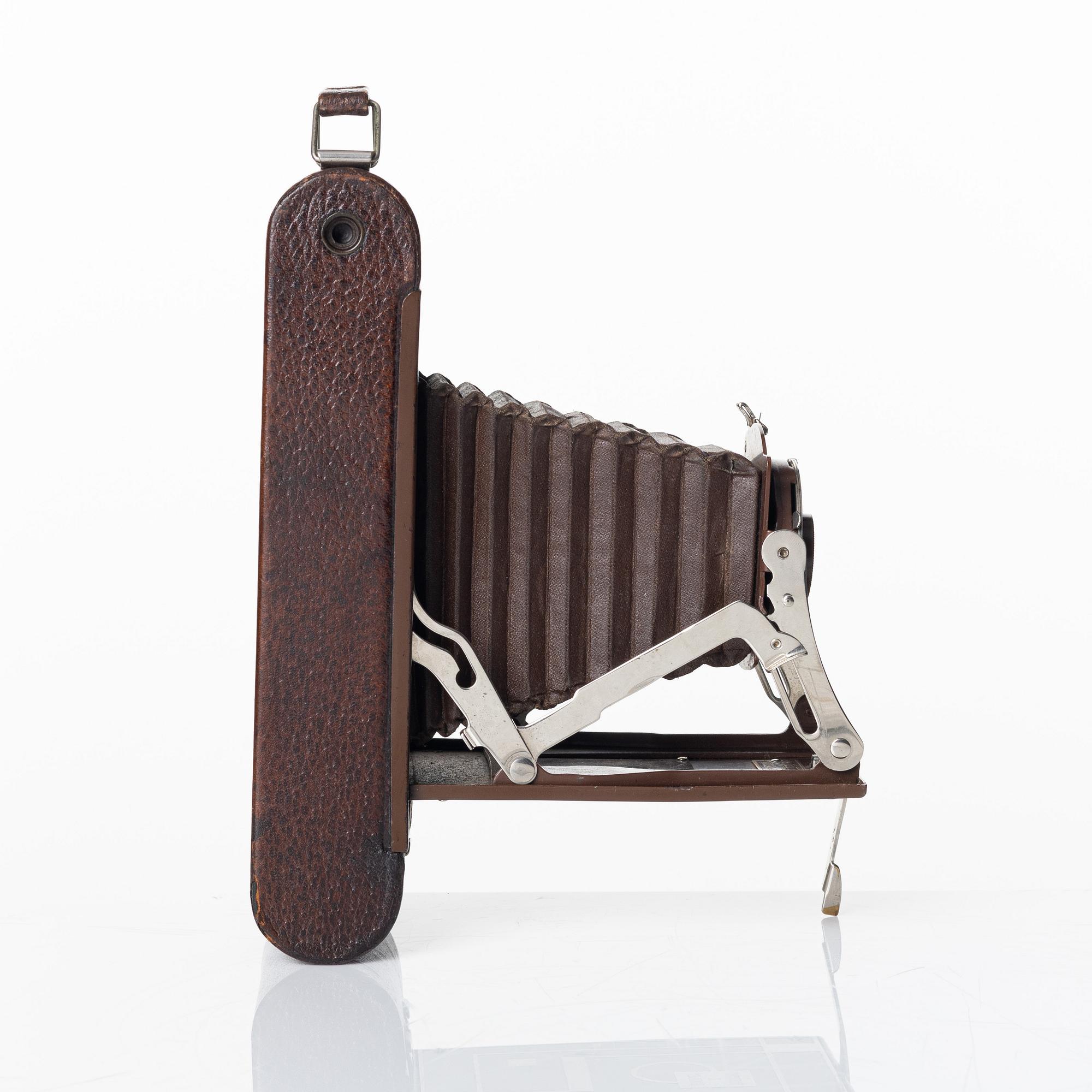 Walter Dorwin Teague, a folding camera in in a lacquered case, USA 1930s.