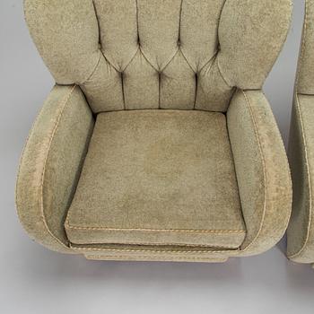 A pair of mid-20th century armchairs.