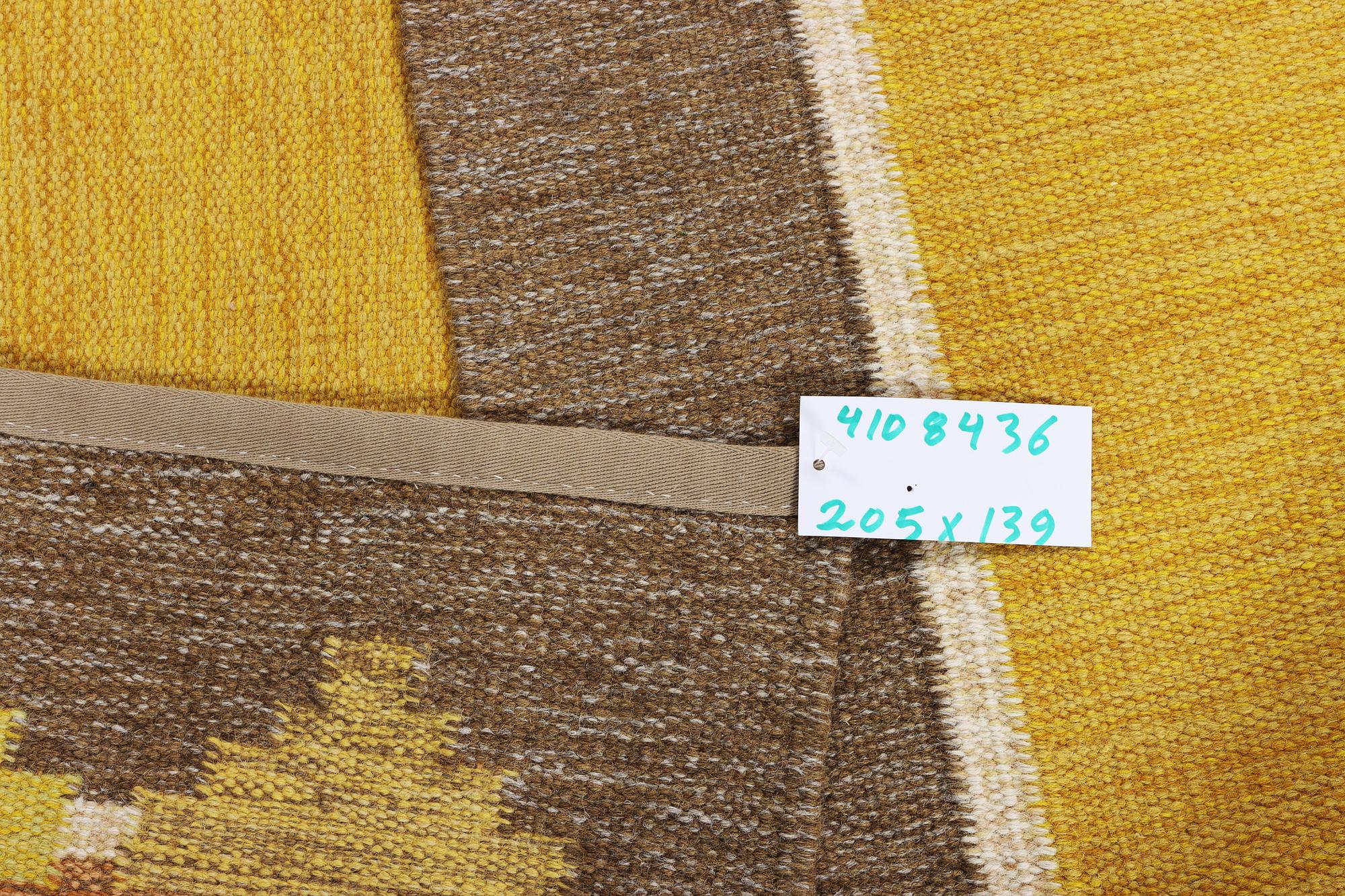A flat weave carpet, signed GS, c. 205 x 139 cm.