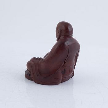 Six Chinese carved wooden figurines, 20th century.