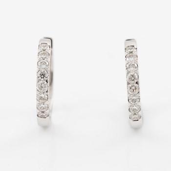 A pair of earrings in 18K white gold set with flander cut diamonds.