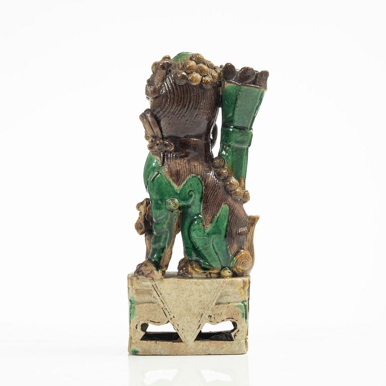 A Sancai glazed Buddhist lion incense/joss stick holder, Qing dynasty, Kangxi (1662-1722).